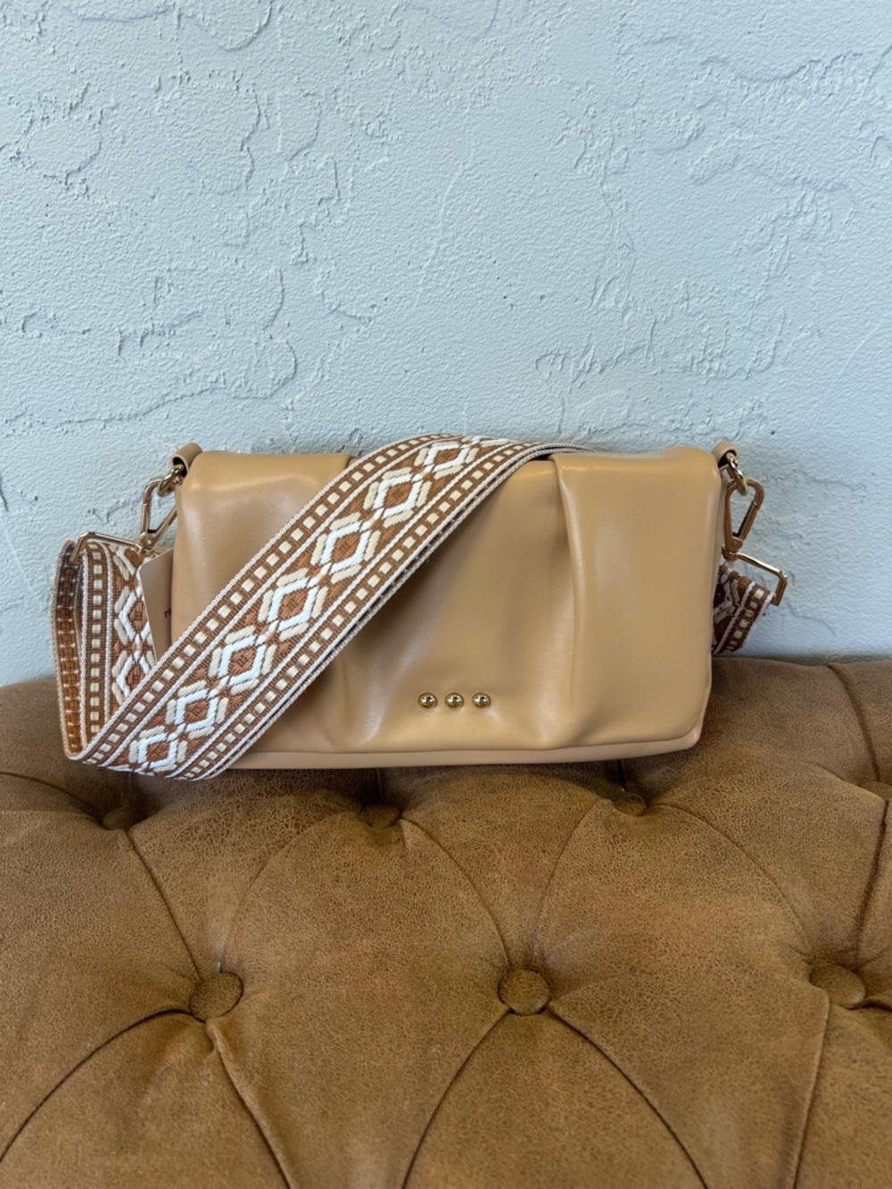 Neutral Tan Leather Crossbody Bag with Patterned Strap